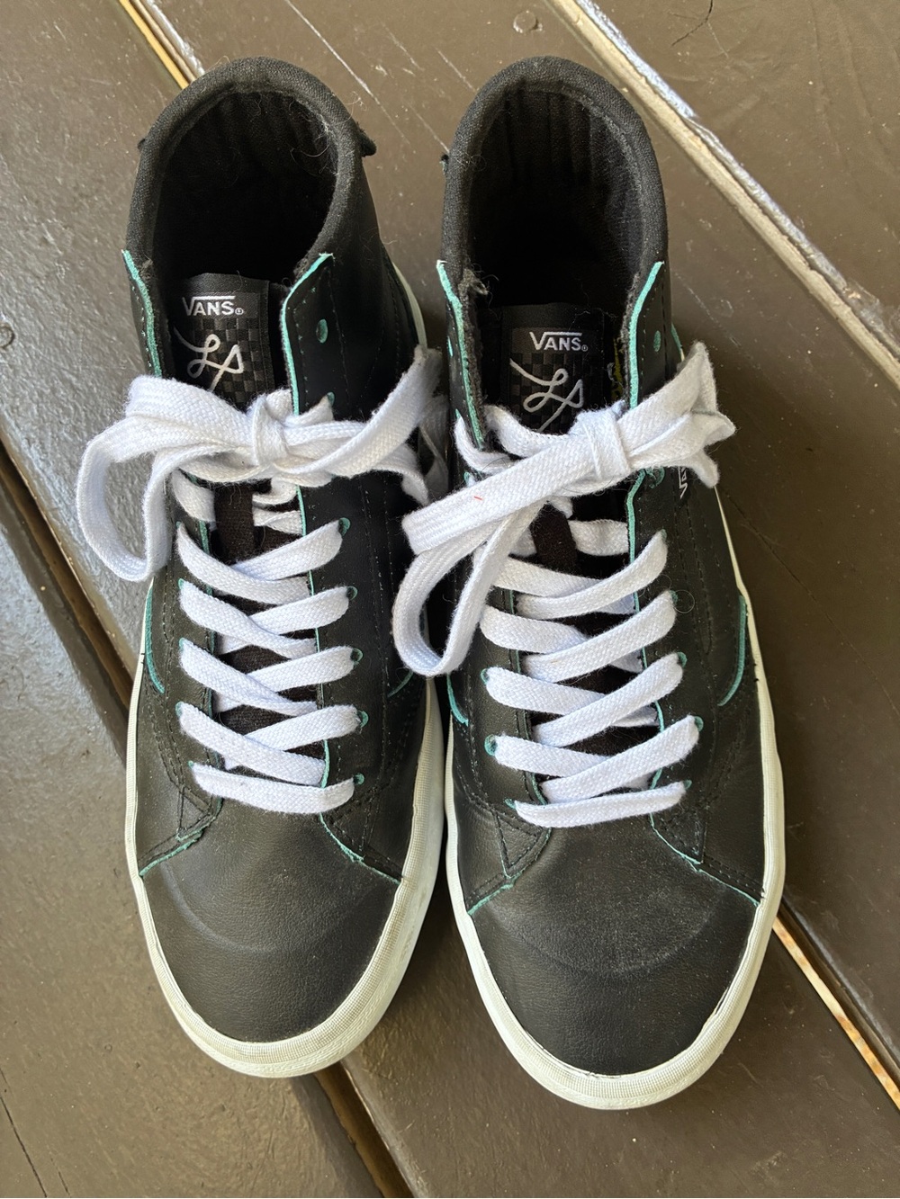Vans Black High-Top Sneakers with White Laces and Teal Stitching